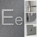 Fasadbokstav E i Aluminium med skruvhål