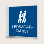 Flaggskylt Ledsagartjänst Blå 150 x 150 mm