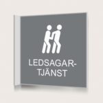Flaggskylt Ledsagartjänst Grå 150 x 150 mm