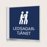 Flaggskylt Ledsagartjänst Mörkblå 150 x 150 mm