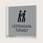 Flaggskylt Ledsagartjänst Silver 150 x 150 mm