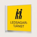 Flaggskylt Ledsagartjänst Gul 150 x 150 mm