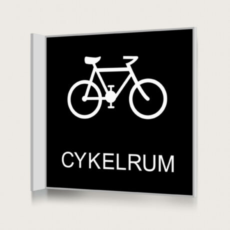 En svart flaggskylt för cykelrum